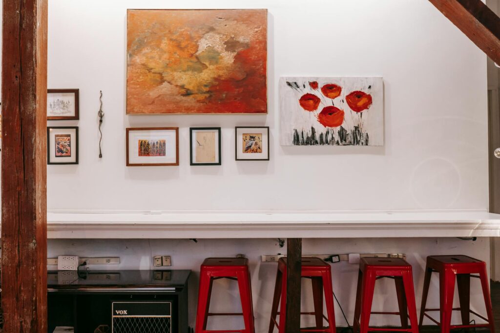 white counter with framed pictures